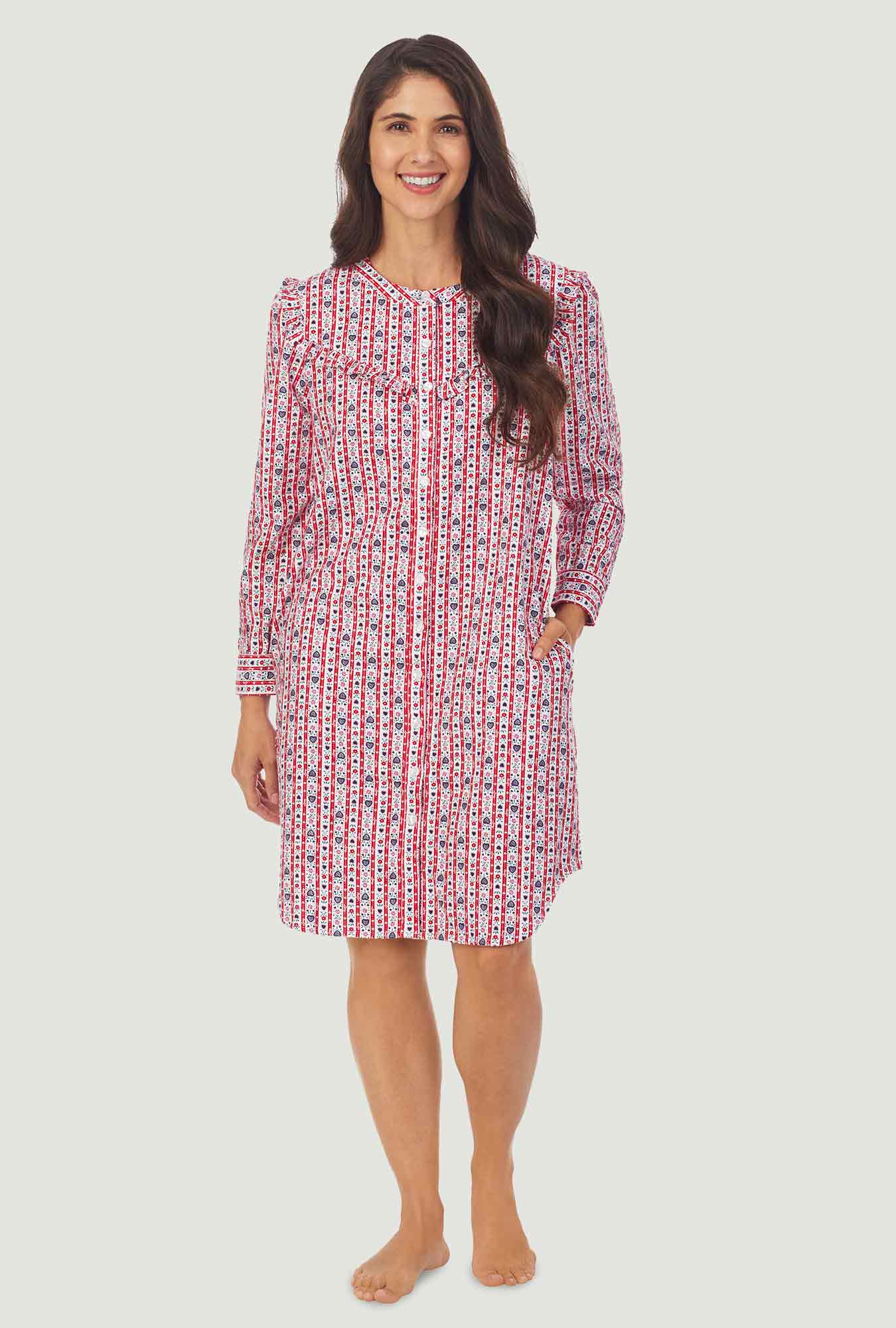 A lady wearing a red tyrolean long sleeve womens nightshirt.