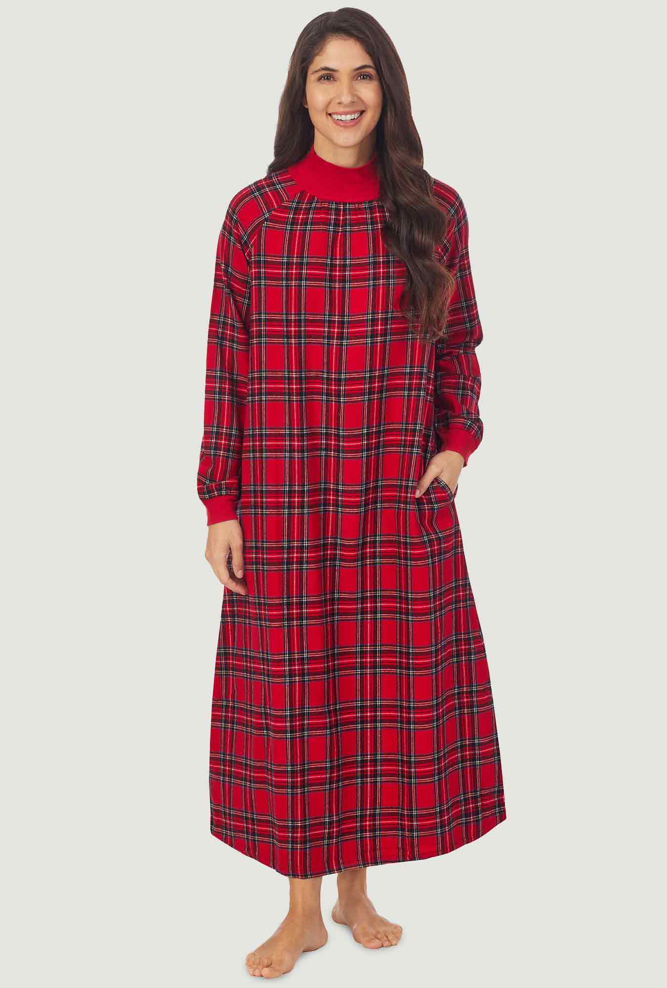  A lady wearing a red tartan long sleeve pop over flannel gown.