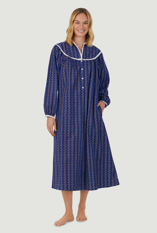 A lady wearing navy long sleeve gown with vintage navy heart stripe print.