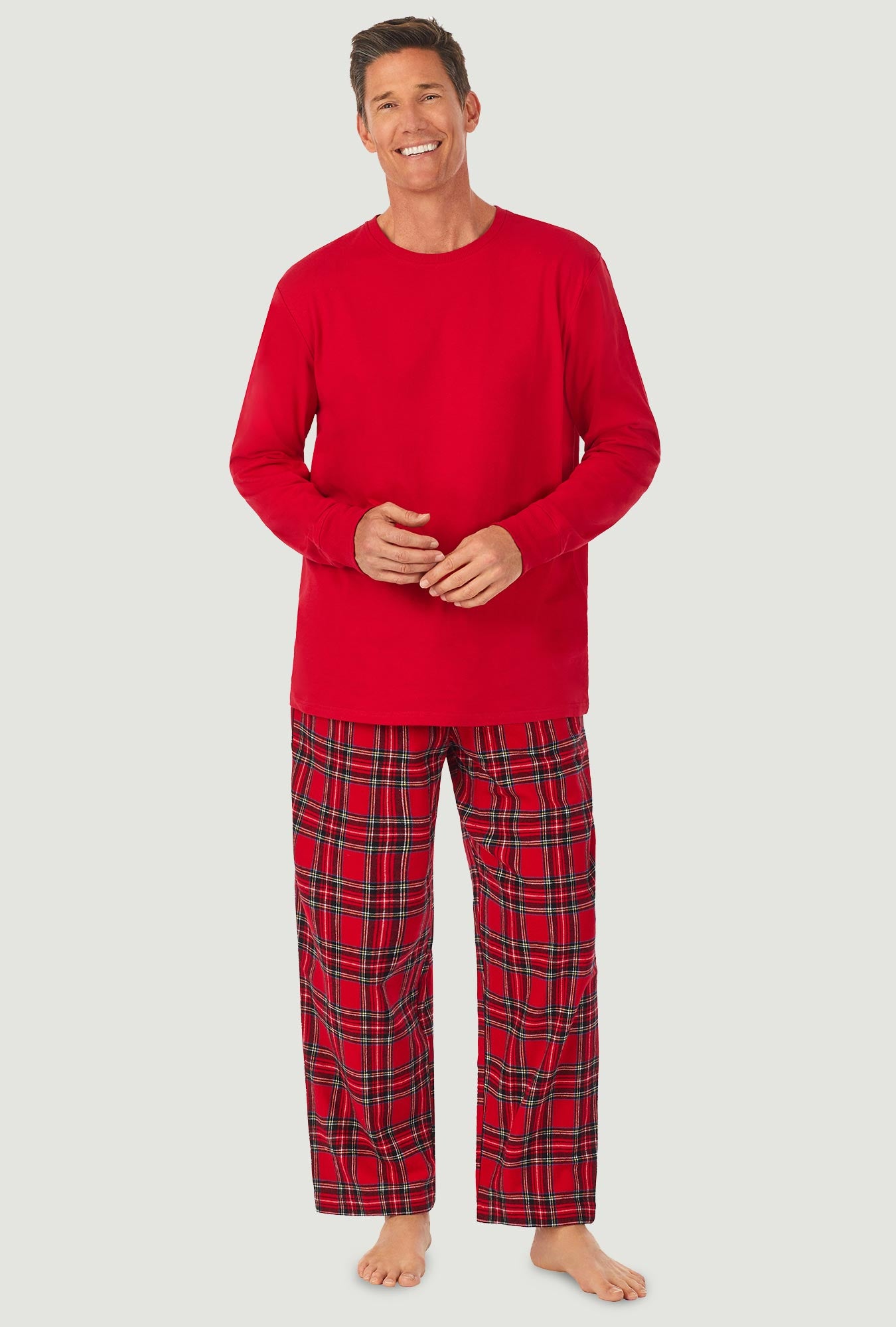 A man wearing a red tartan long sleeve knit & flannel pj set.