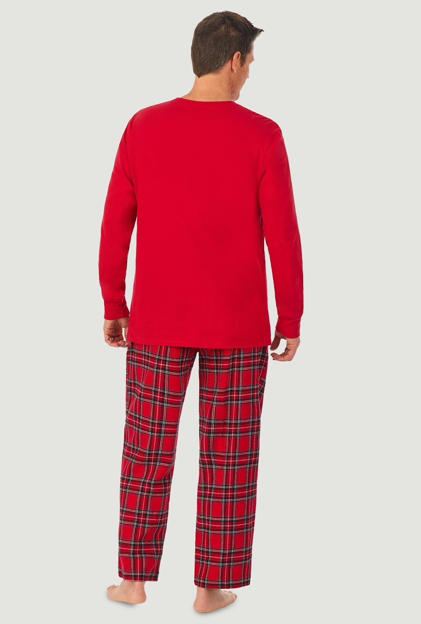 A man wearing a red tartan long sleeve knit & flannel pj set.