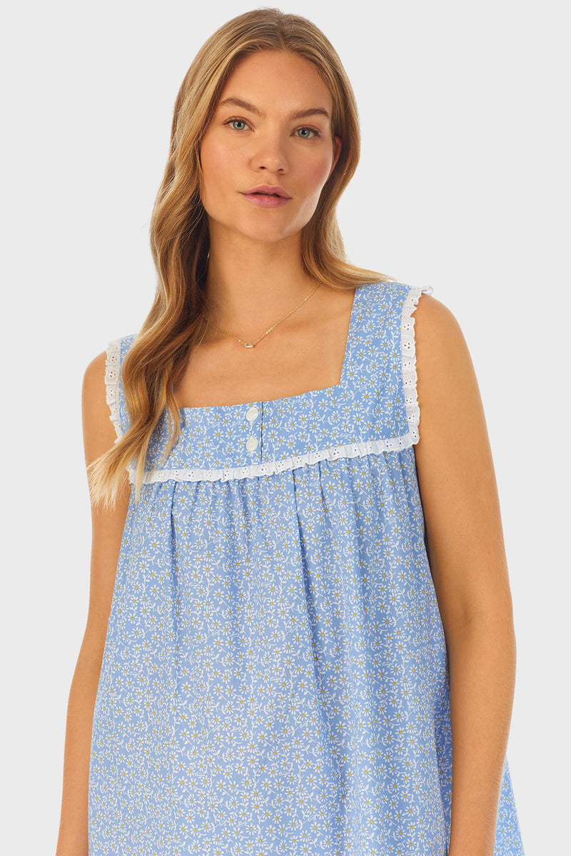 A lady wearing blue short gown with white pattern