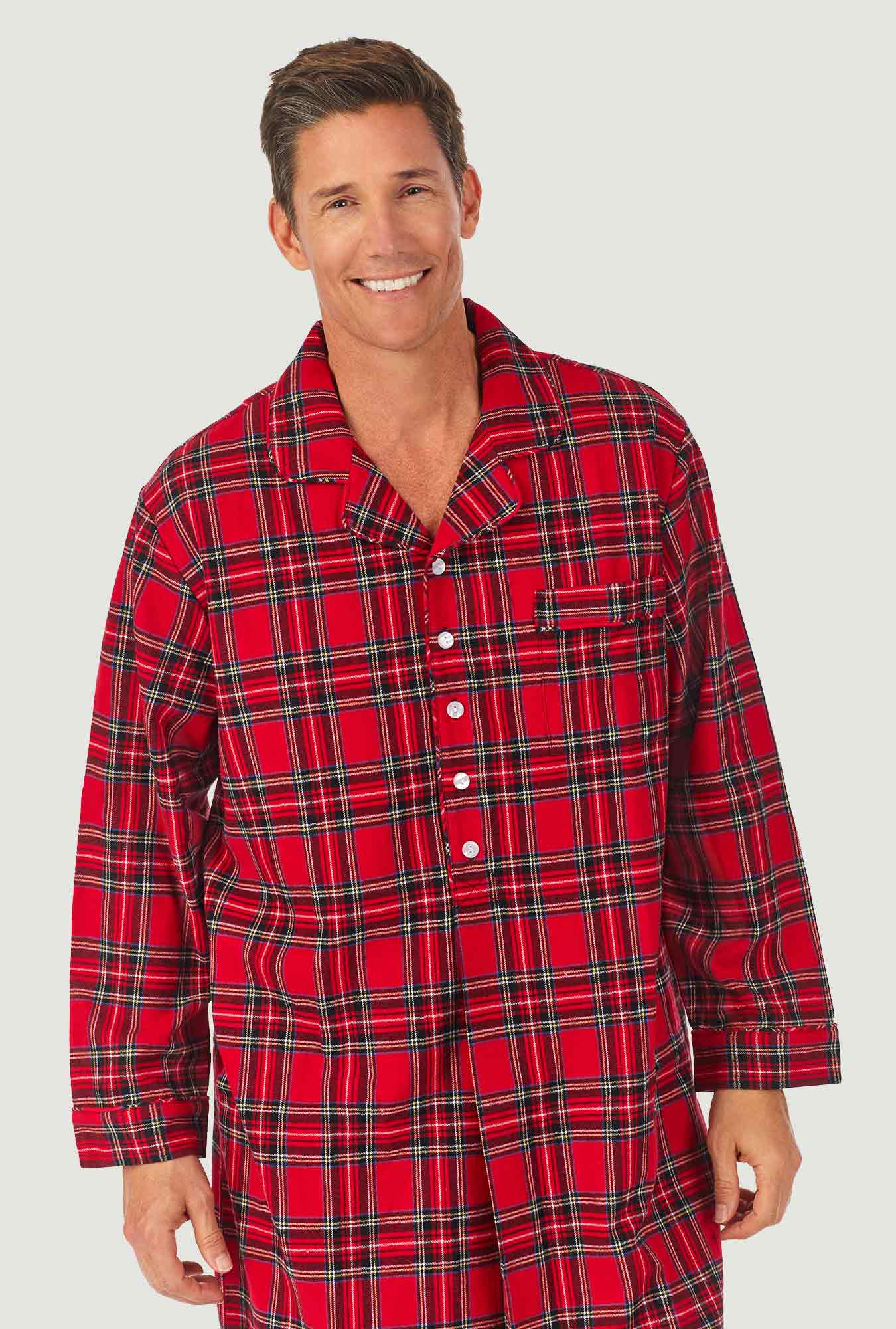 A man wearing a red tartan long sleeve mens classic nightshirt.