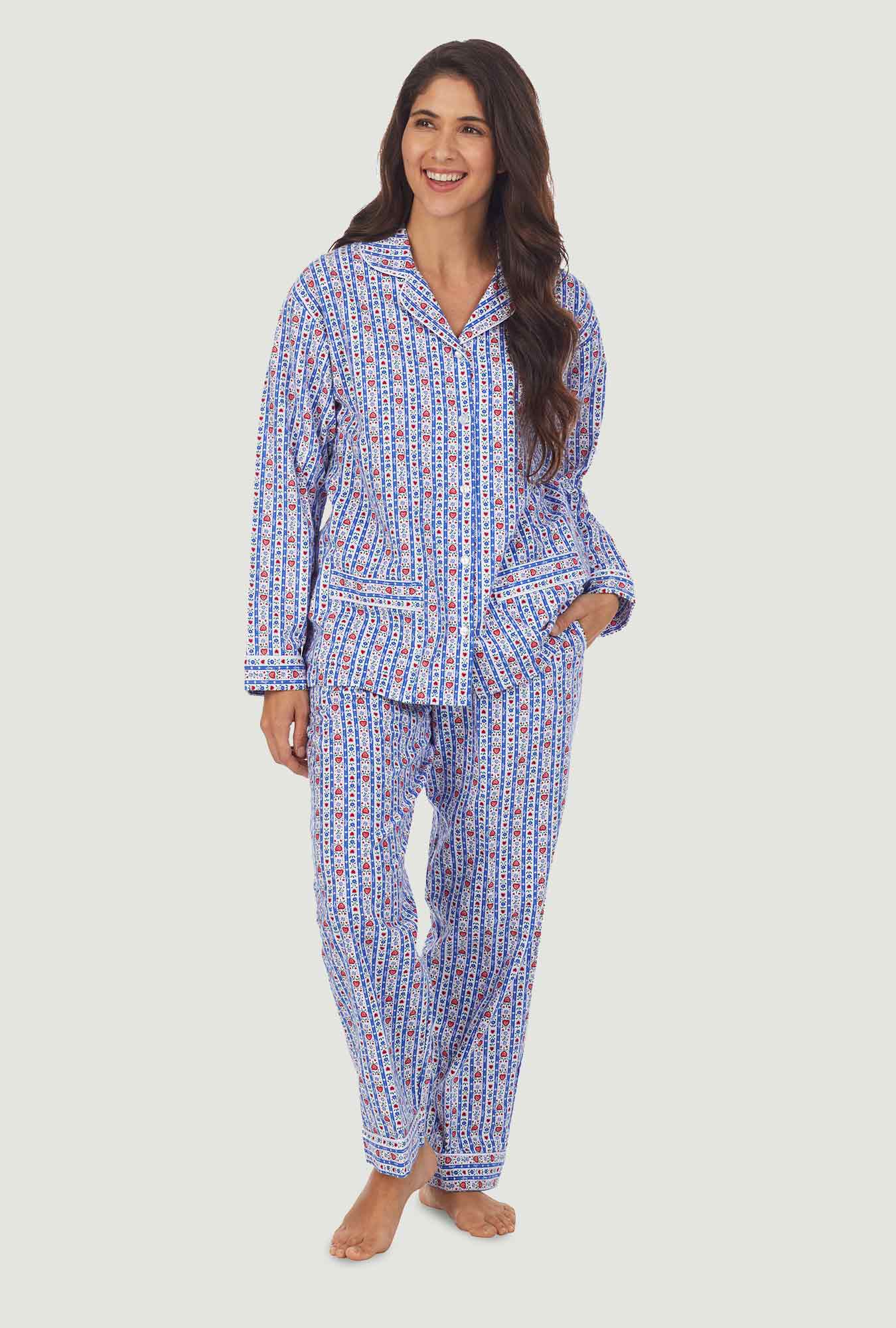 A lady wearing a blue long sleeve flannel pajama with tyrolean stripe pattern.