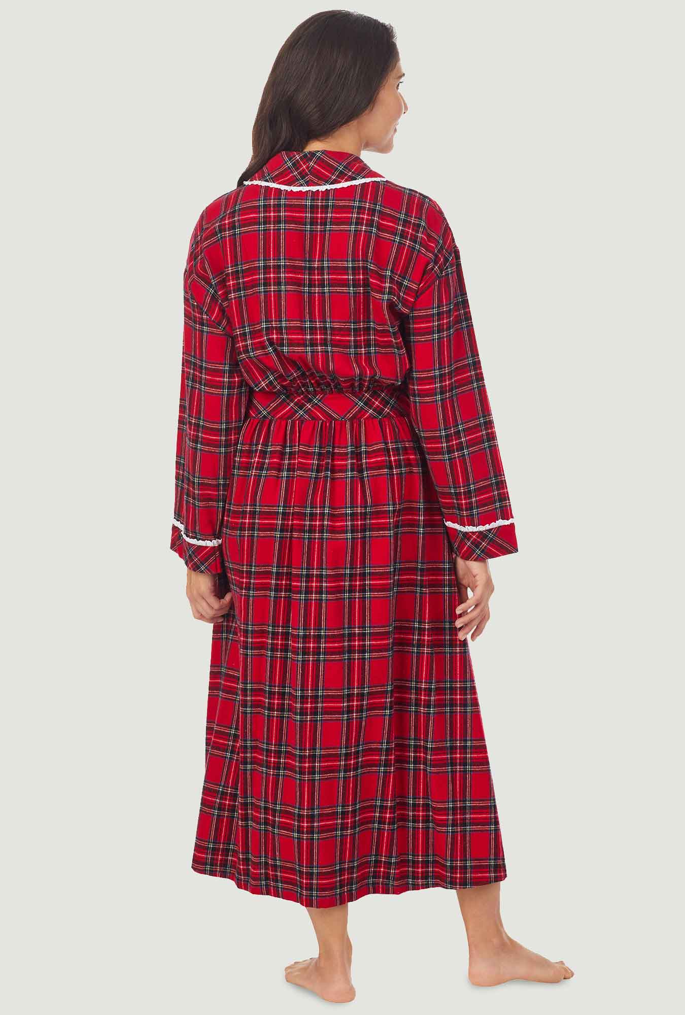 A lady wearing a red long sleeve tartan plaid flannel robe.