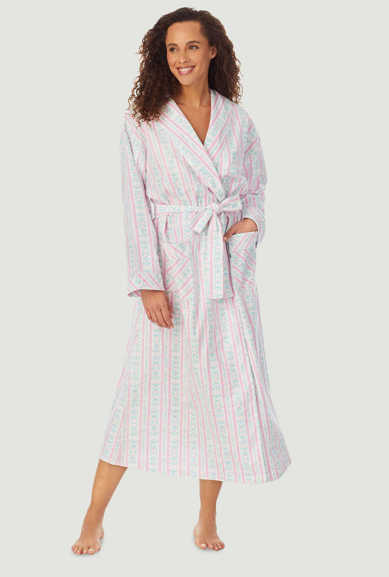 A lady wearing a pink tyrolean long sleeve classic wrap robe.