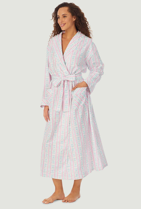 A lady wearing a pink tyrolean long sleeve classic wrap robe.