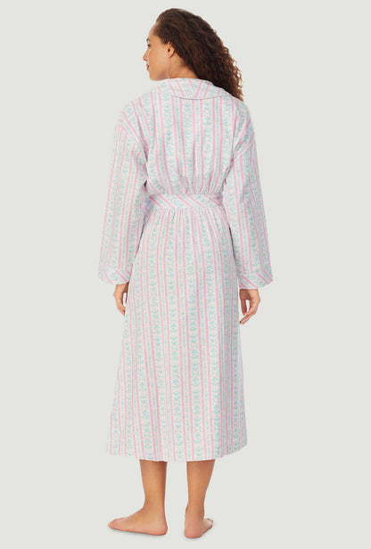 A lady wearing a pink tyrolean long sleeve classic wrap robe.