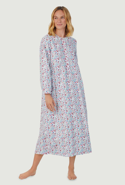 A lady wearing multi color long sleeve flannel gown with sweet & simple cardinal & heart print.