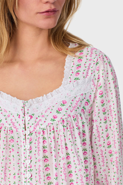 A lady wearing Rosey Tyrolean Cotton Lawn Ballet Button Front Robe