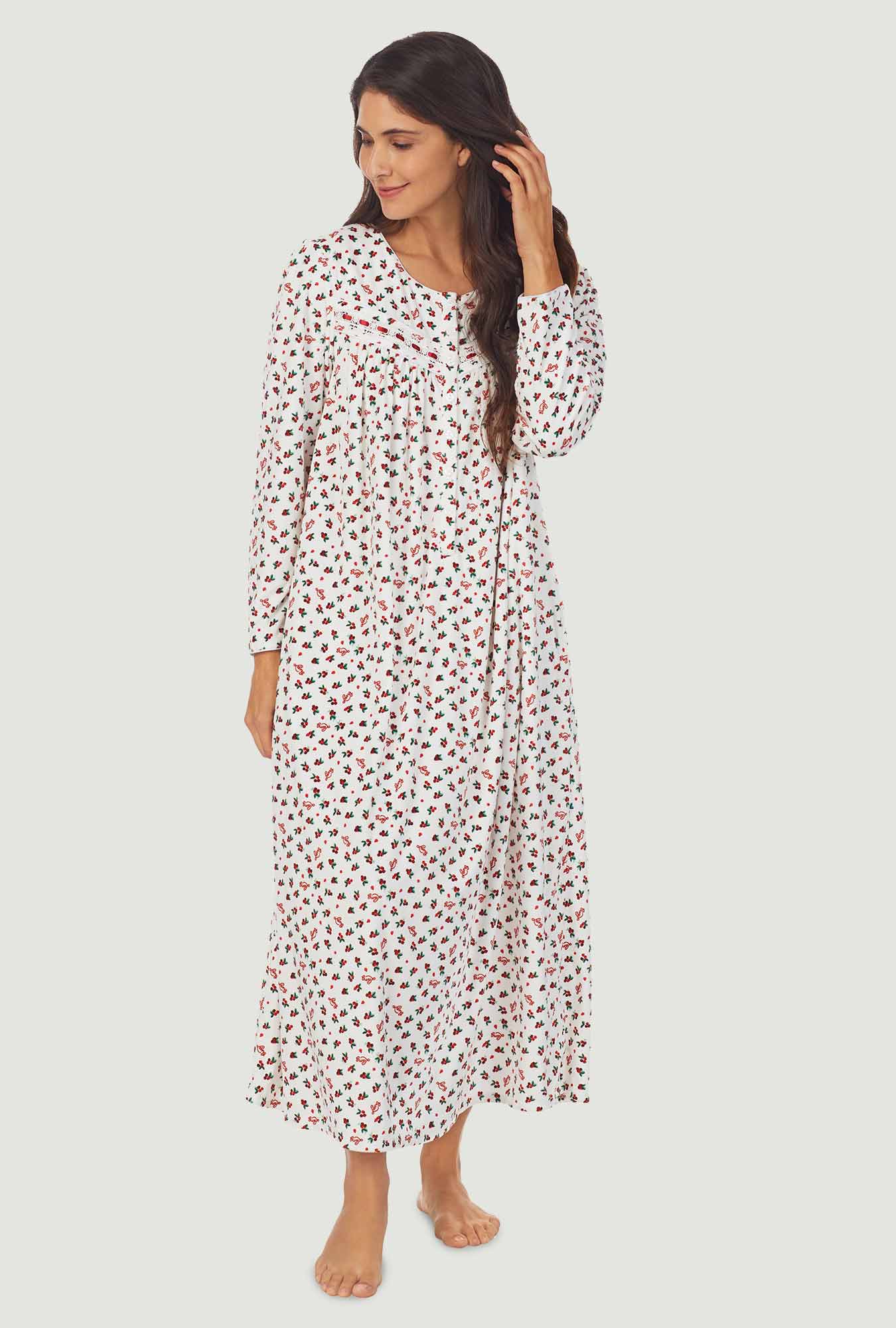 A lady wearing a lanz berry floral long sleeve cozy fleece gown.