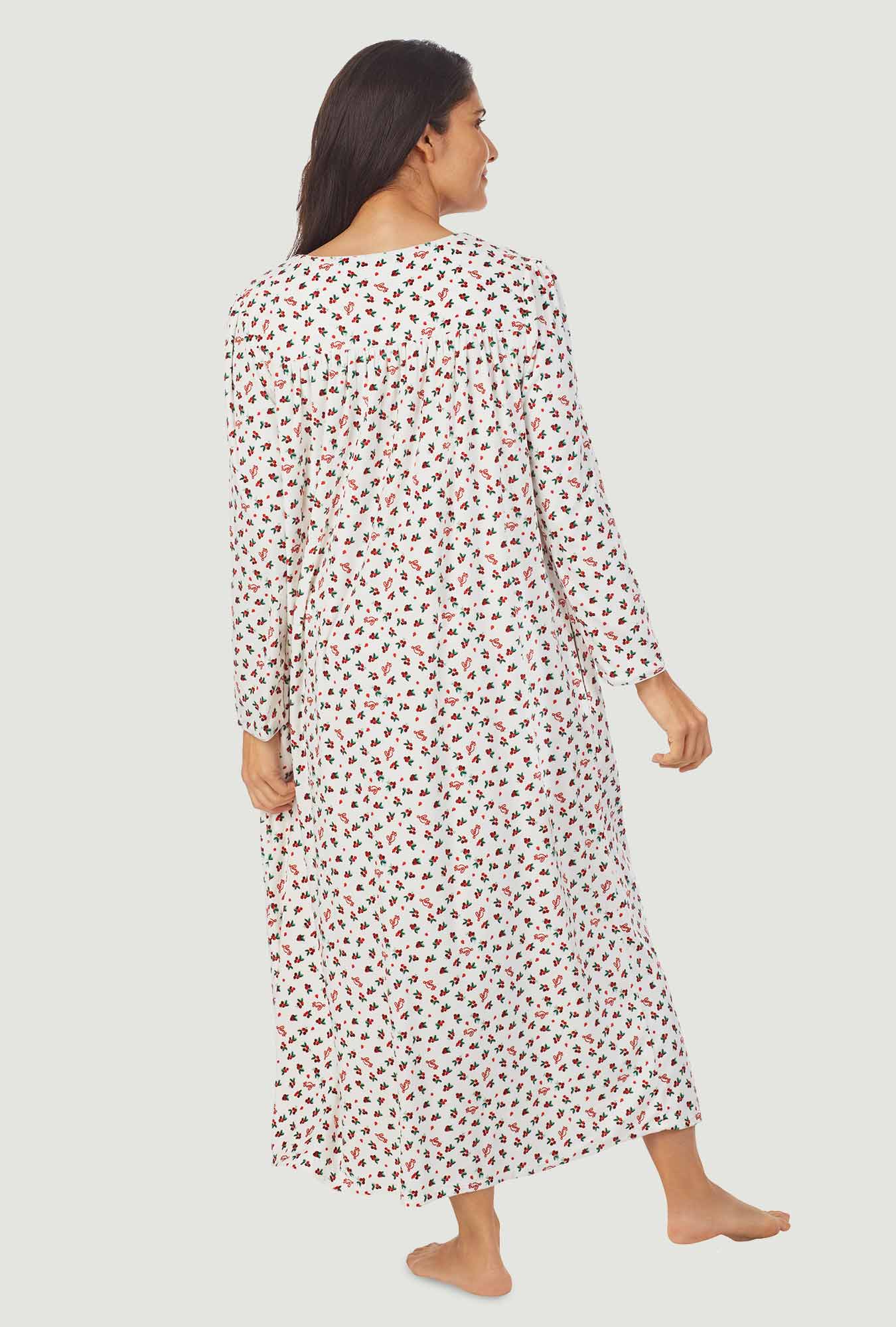 A lady wearing a lanz berry floral long sleeve cozy fleece gown.