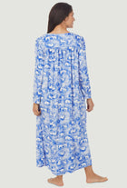   A lady wearing a polar bears long sleeve cozy fleece gown.