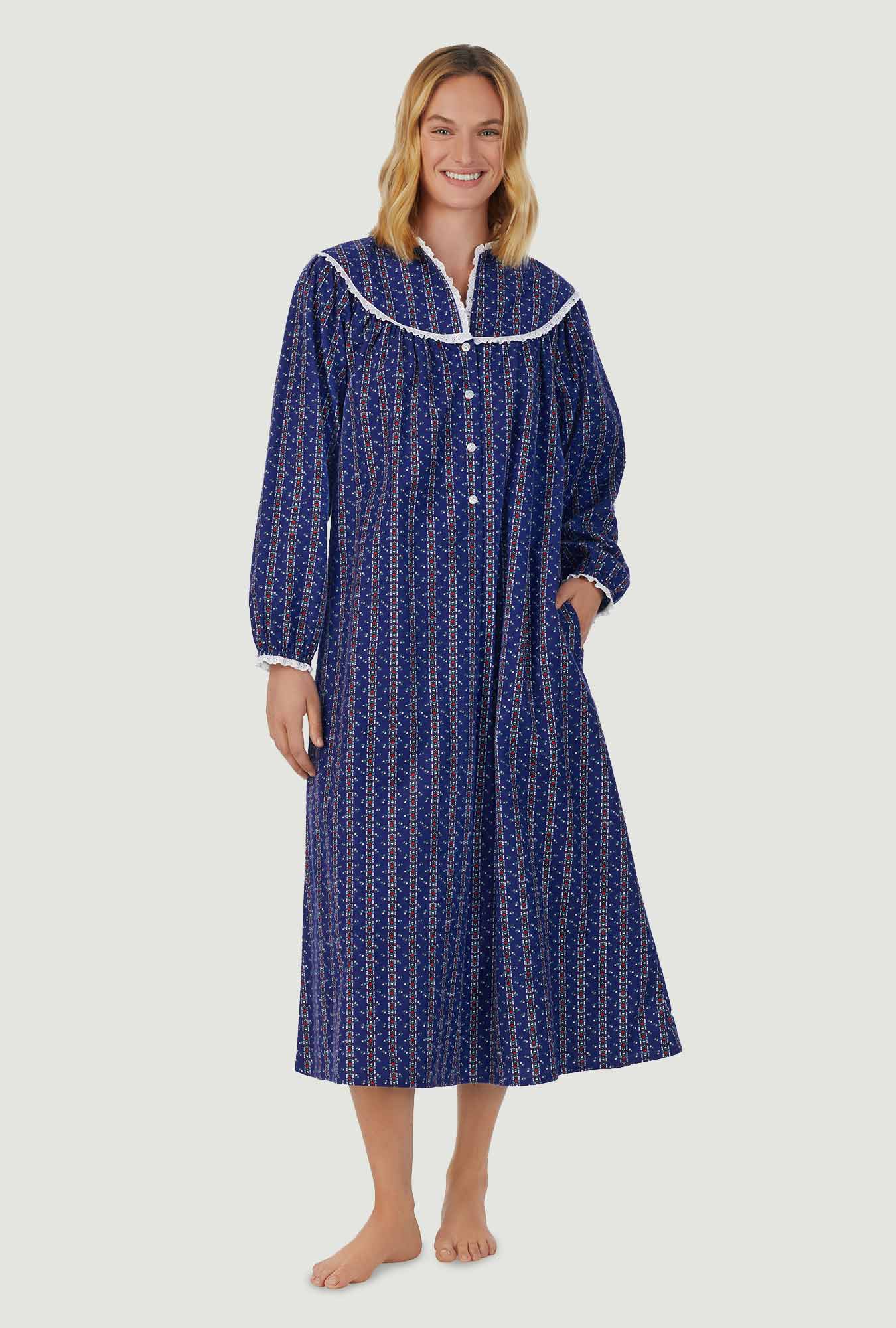 A lady wearing navy long sleeve gown with vintage navy heart stripe print.