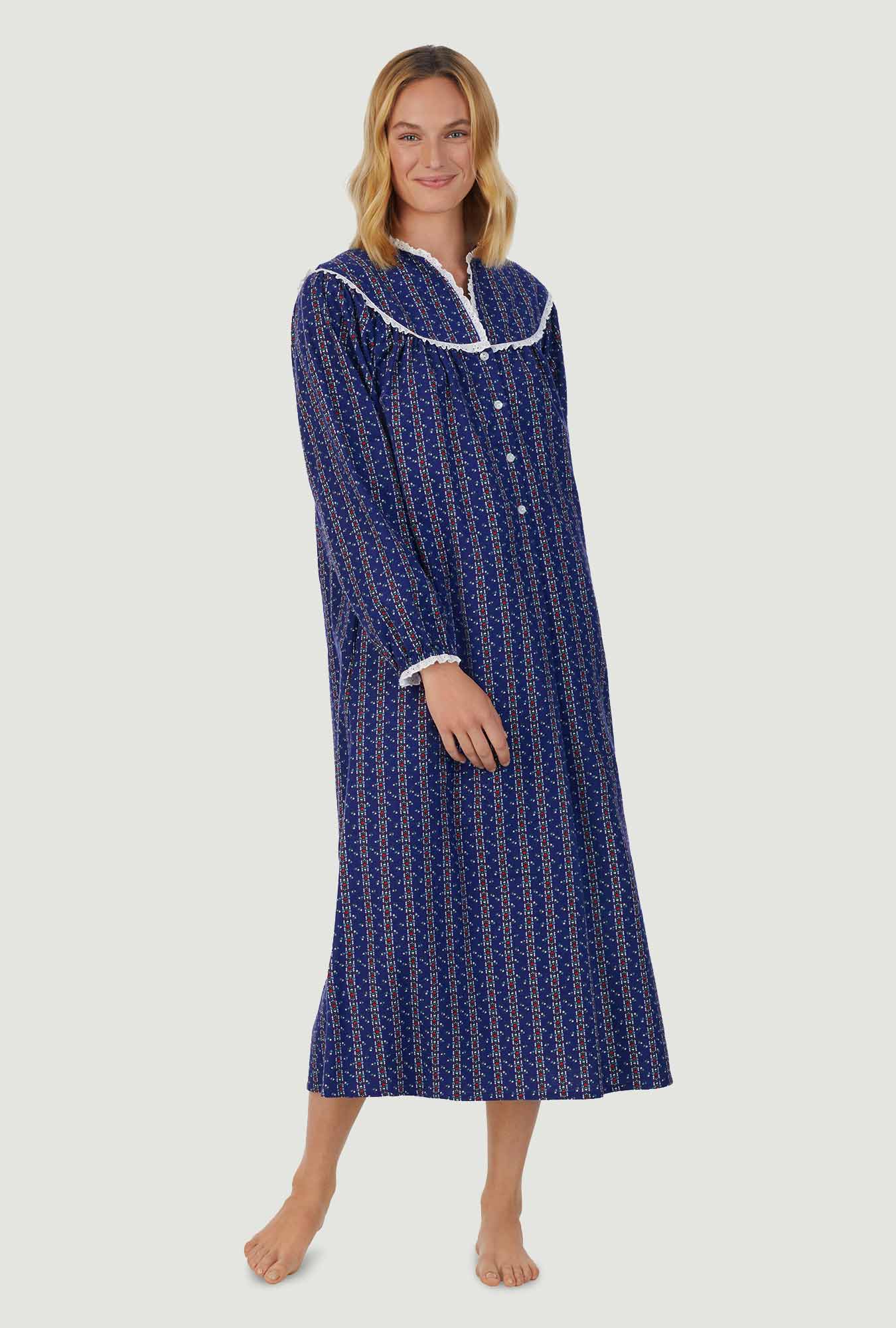 A lady wearing navy long sleeve gown with vintage navy heart stripe print.