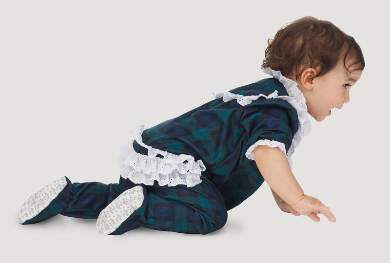 A baby wearing a black watch long sleeve rumba.