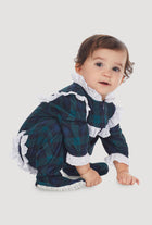 A baby wearing a black watch long sleeve rumba.