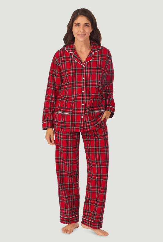 A lady wearing a red tartan long sleeve women's flannel pajama.