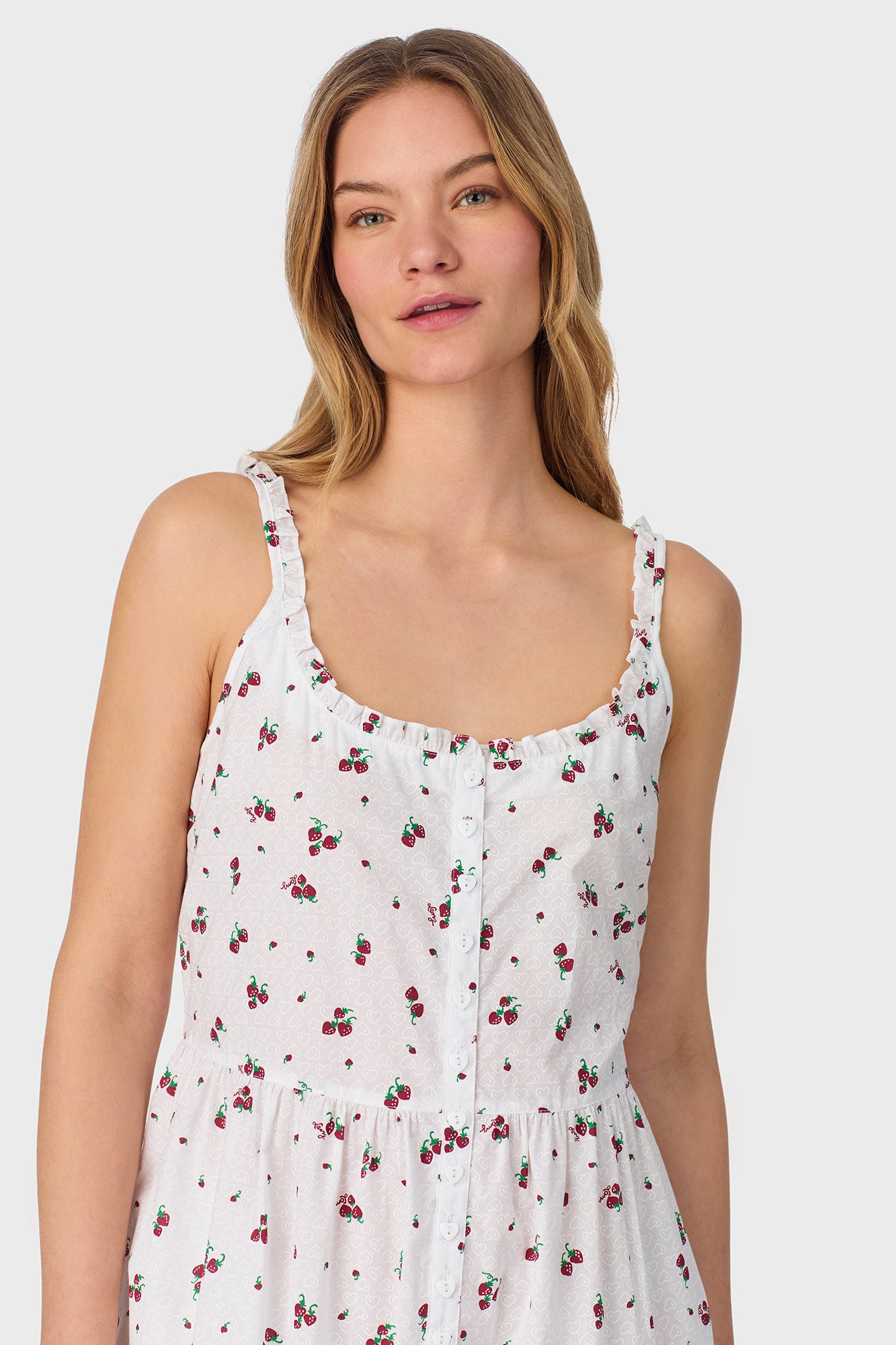 A lady wearing Strawberry Jubilee Cotton Lawn Sundress