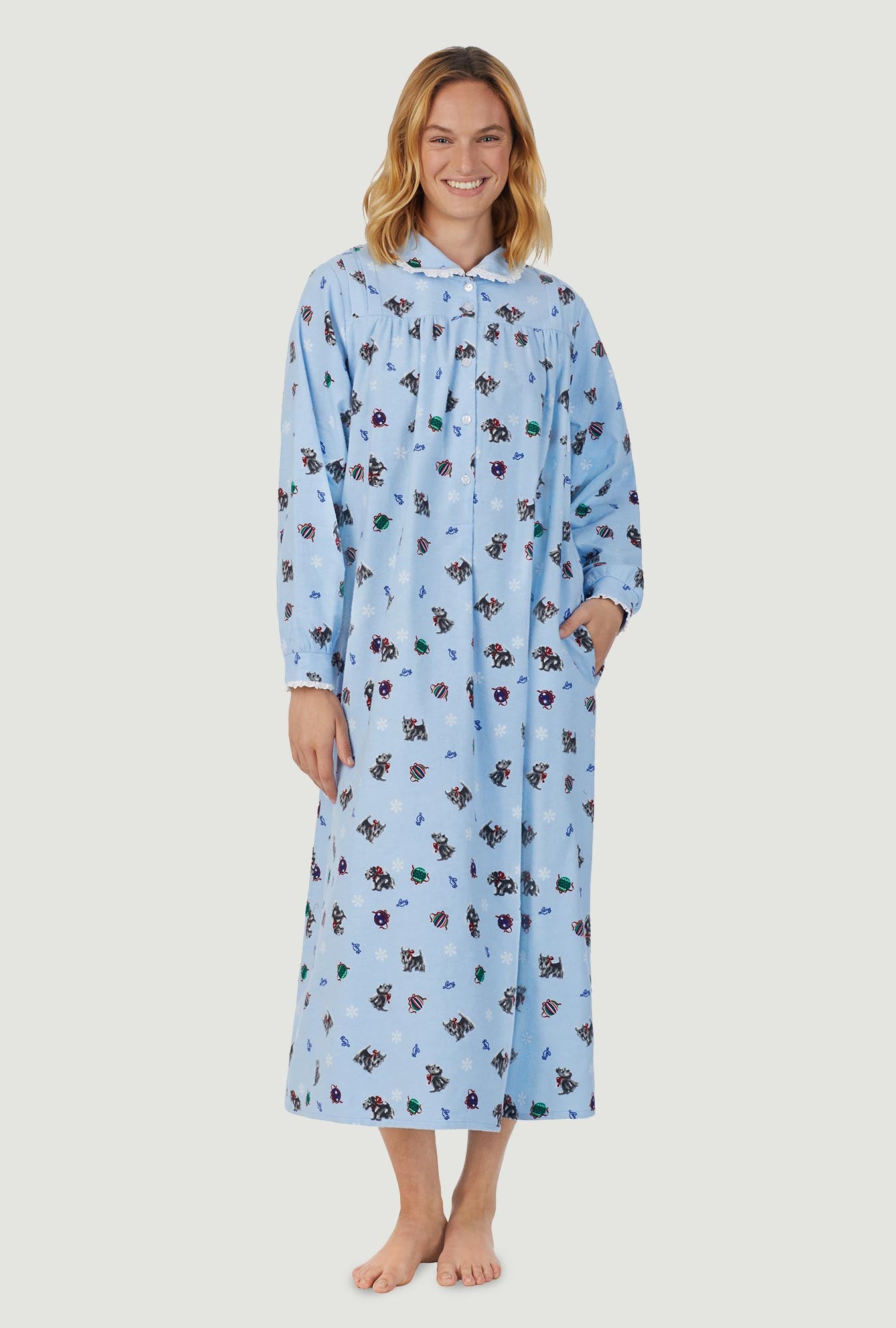 A lady wearing blue peter pan flannel gown with scottie dogs on parade print.