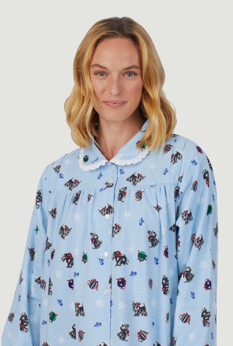 A lady wearing blue peter pan flannel gown with scottie dogs on parade print.