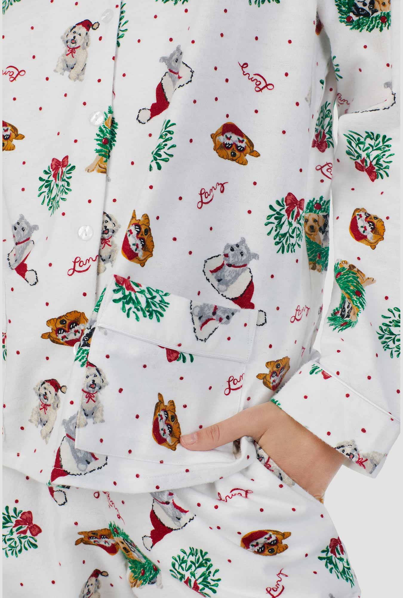 A lady wearing white long sleeve classic notch pajama with holiday puppies print.