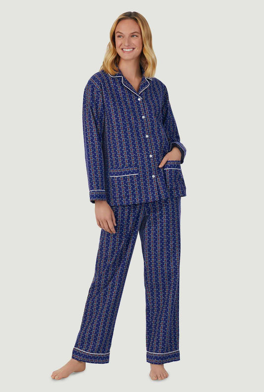 A lady wearing navy long sleeve classic notch pajama with vintage navy heart stripe print.