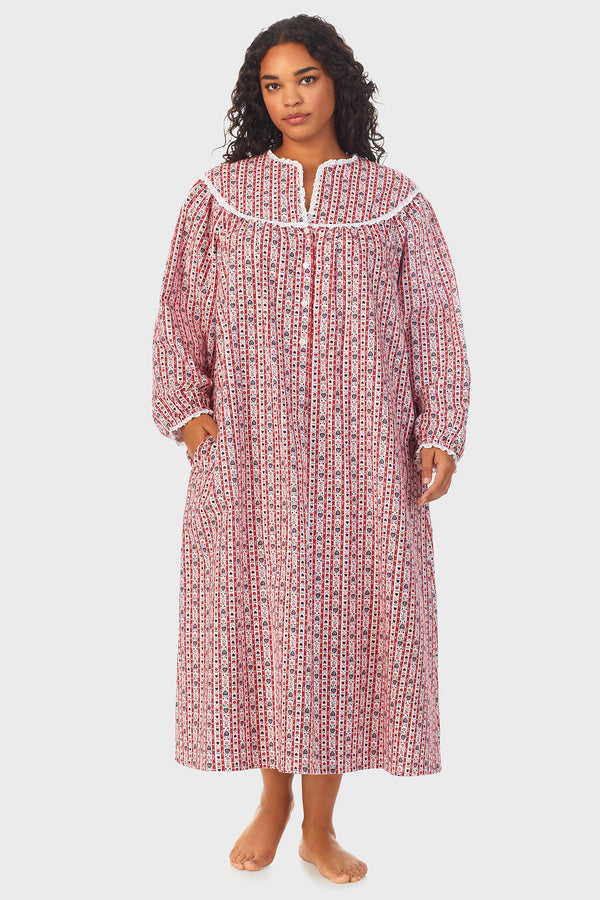 A lady wearing a red tyrolean long sleeve flannel gown plus.