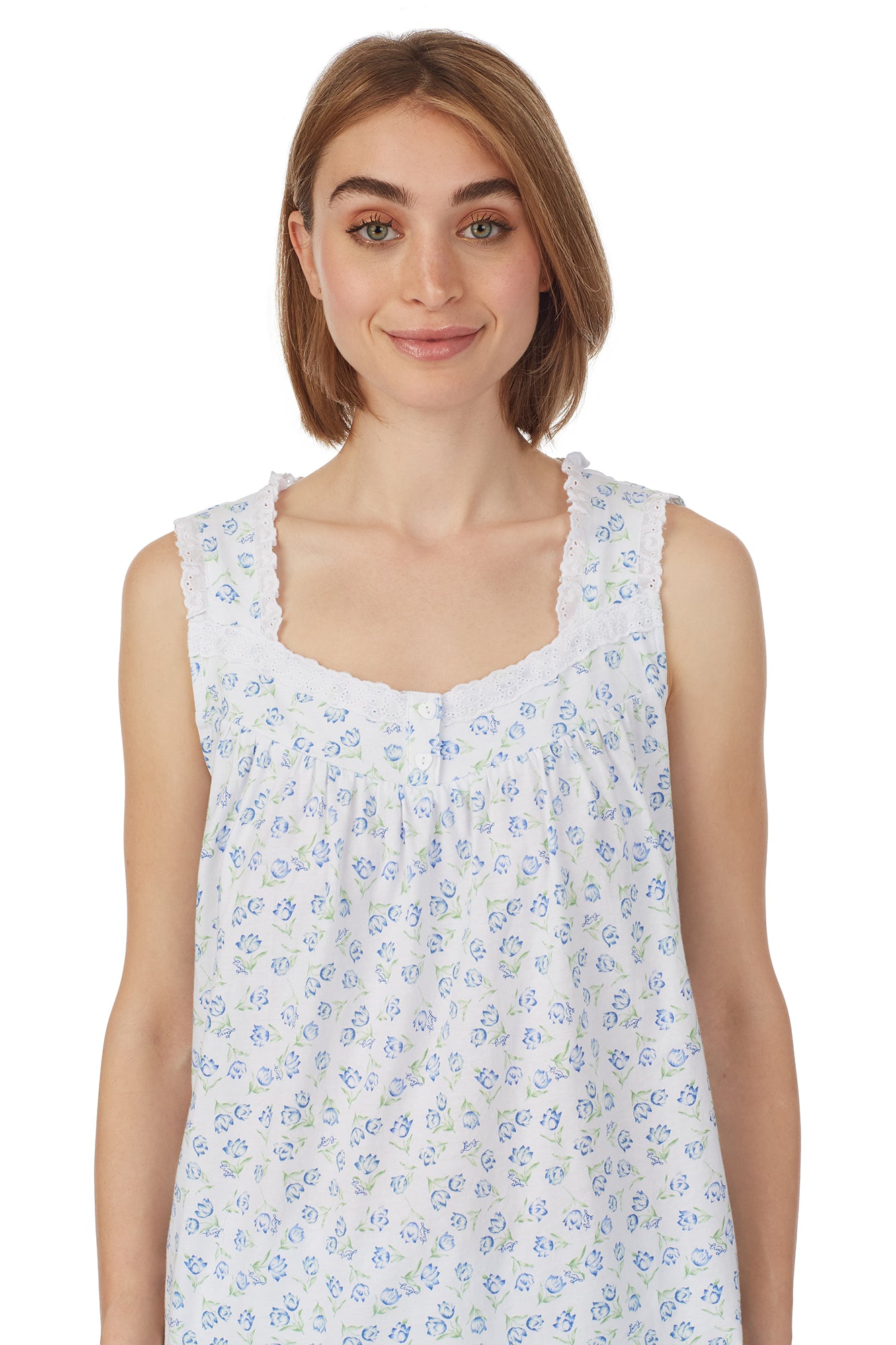 A lady wearing  a sleeveless knit shortie pajama with tulip pattern.