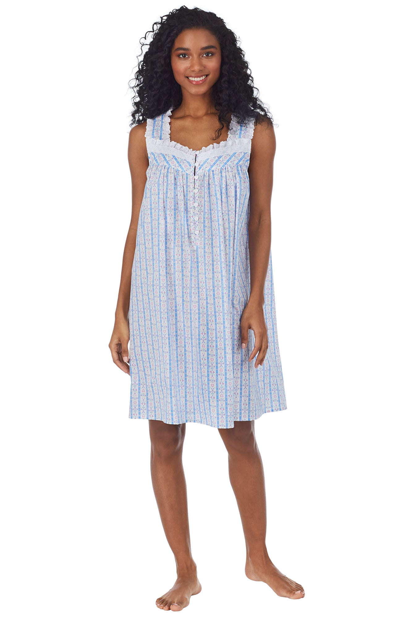 A lady wearing white short nightgown with blue pattern