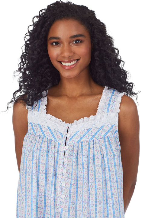 Upper body of A lady wearing white short nightgown with blue pattern
