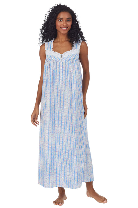 A lady wearing blue long nightgown with pink heart pattern