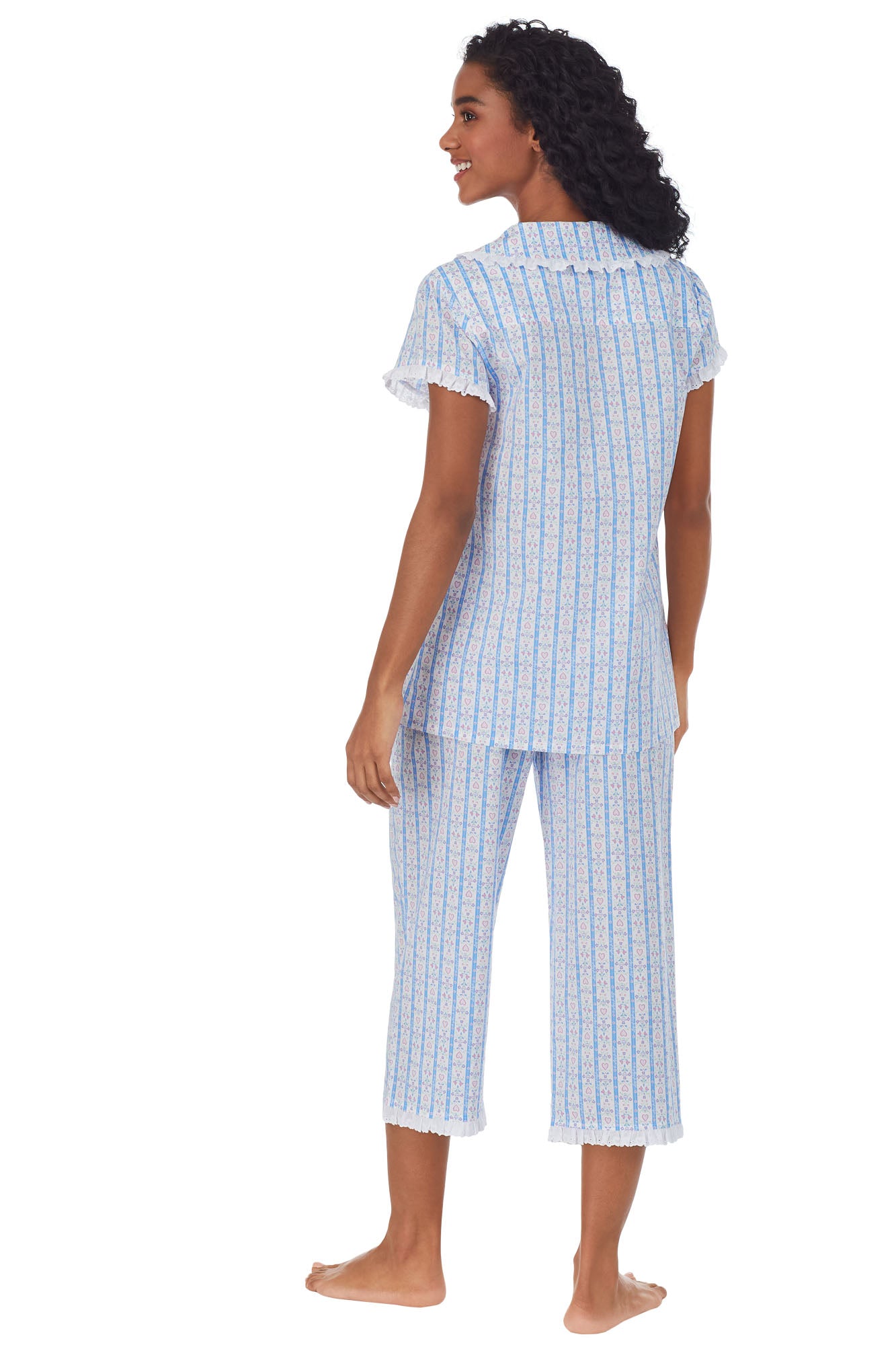 Back view of A lady wearing white pajama with blue pattern