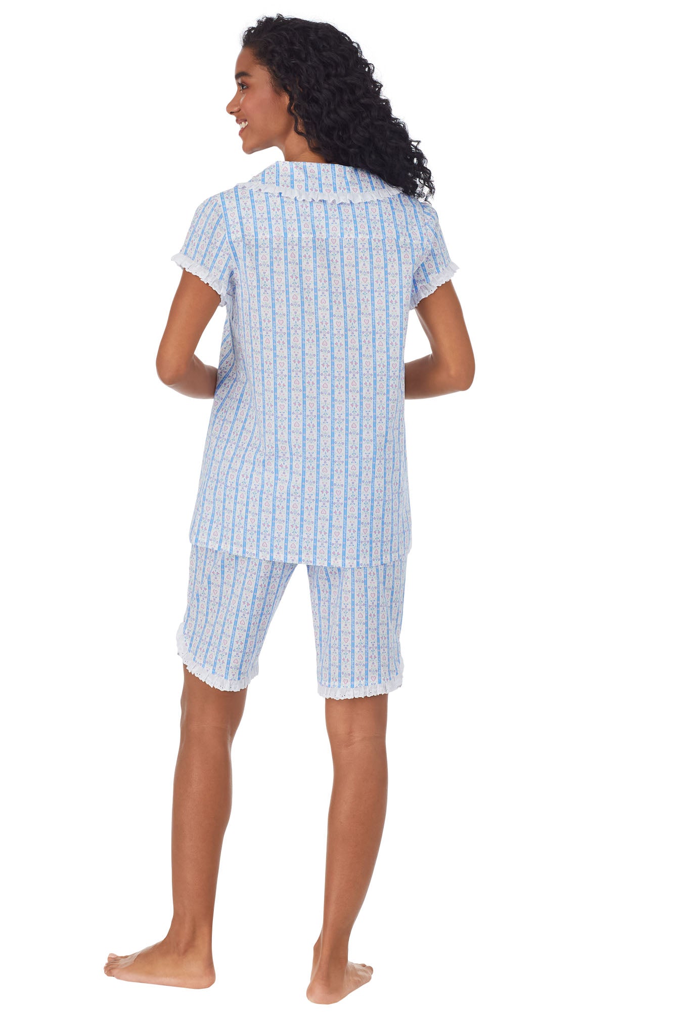 Back view of A lady wearing white short pajama set with blue pattern