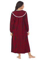 A lady wearing a buffalo check long sleeve flannel gown.