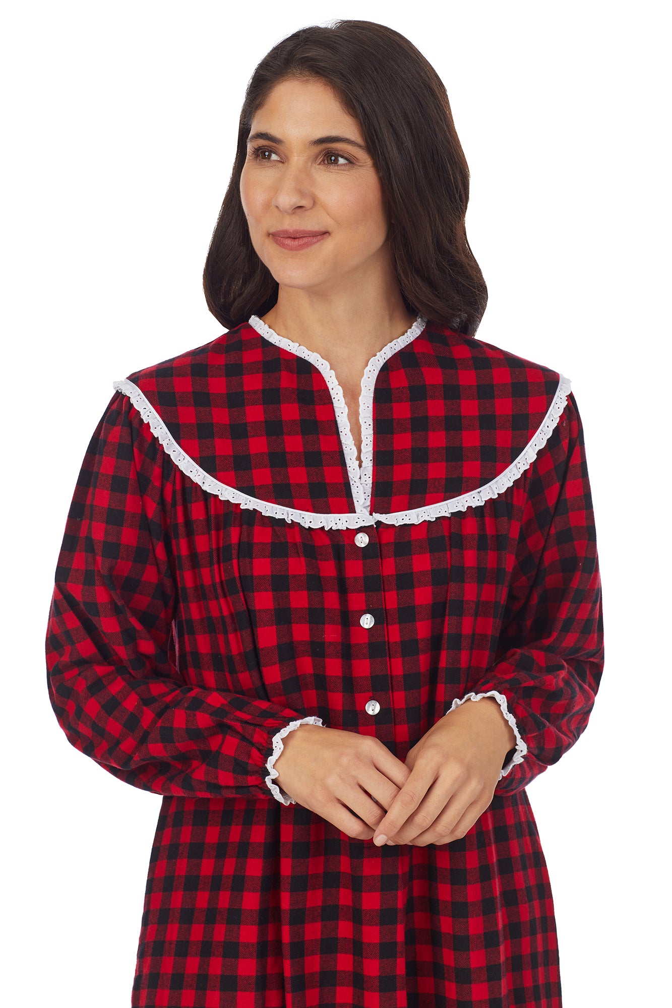 A lady wearing a buffalo check long sleeve flannel gown.