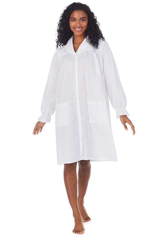 A lady wearing a white long sleeve cotton short robe.