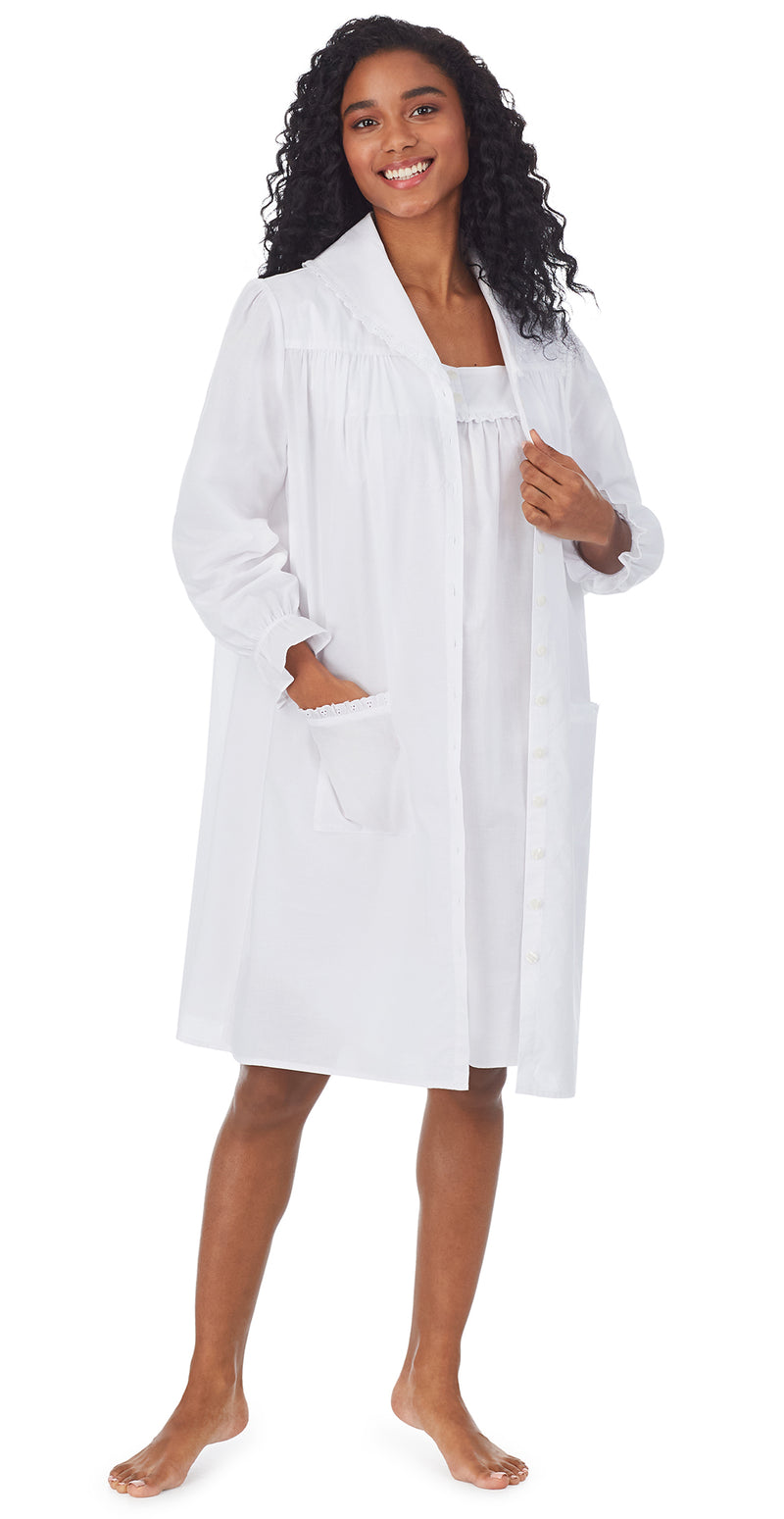 A lady wearing a white long sleeve cotton short robe.