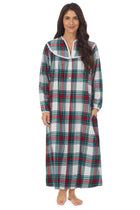 A lady wearing a holiday plaid long sleeve flannel gown.